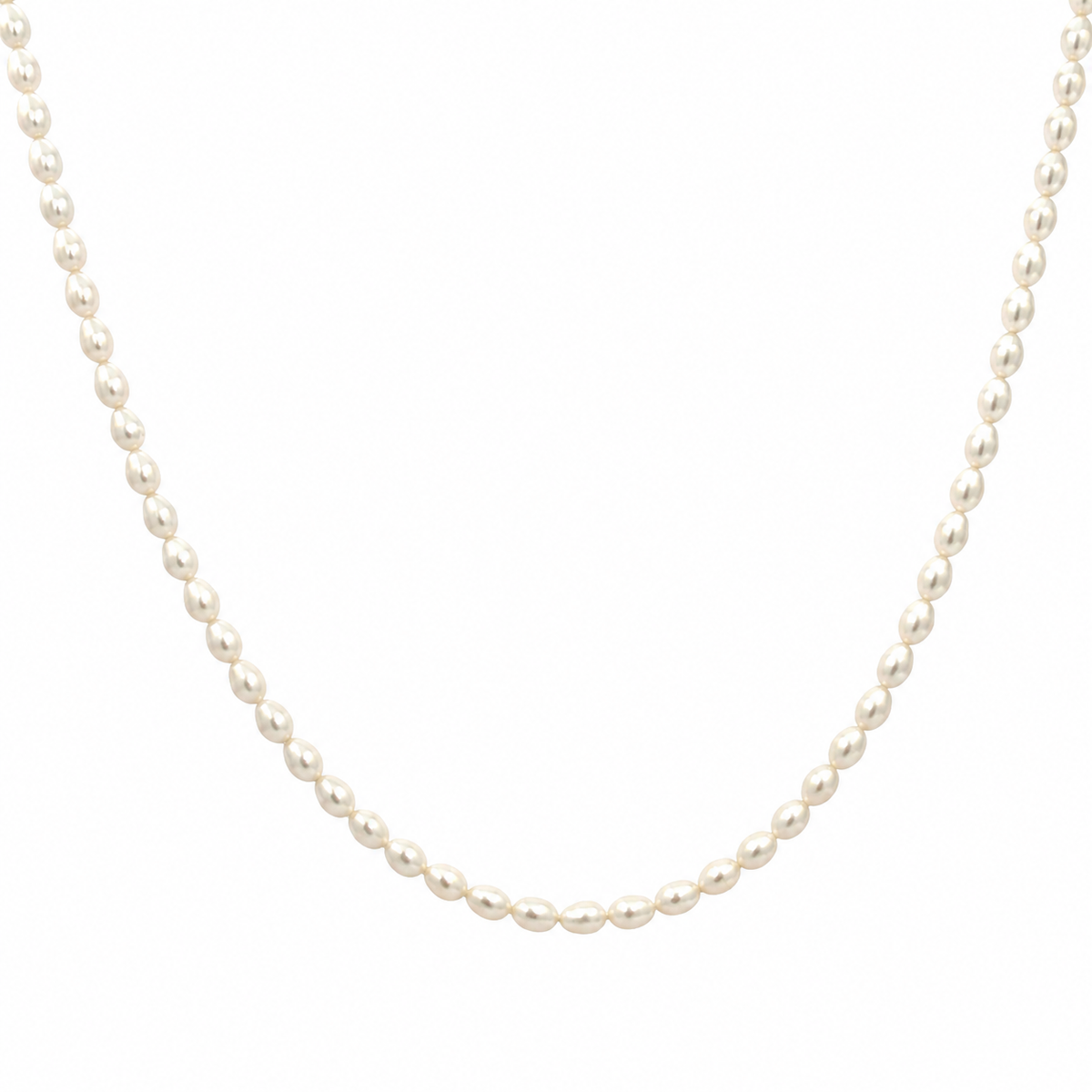 Freshwater pearl necklace with 90 naturally shaped pearls and a 14k yellow gold clasp on a white background