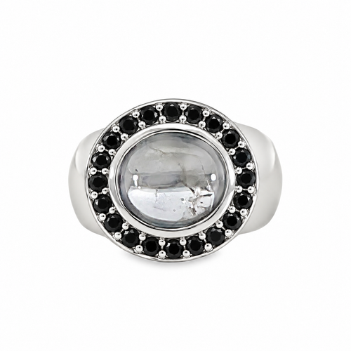 8ct white gold statement ring featuring an oval black spinel cabochon surrounded by a halo of faceted black diamonds, with a wide polished band
