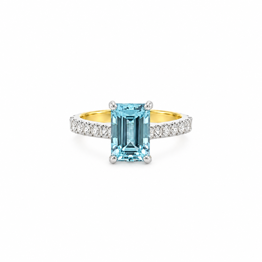 18ct yellow gold and platinum ring featuring a 2.76ct emerald-cut aquamarine with 0.45ct diamond-set shoulders