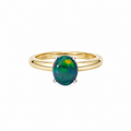18k yellow gold ring with a 2.04 ct oval solid opal in a platinum claw setting on a white background