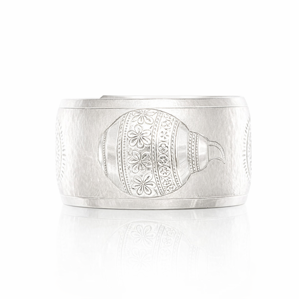 Silver PNG Motif Repousse Cuff