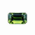 4.67ct natural Australian green sapphire in an elegant rectangular emerald cut, displaying deep forest green, olive and yellow-green hues, available at Jules Collins Jewellery.