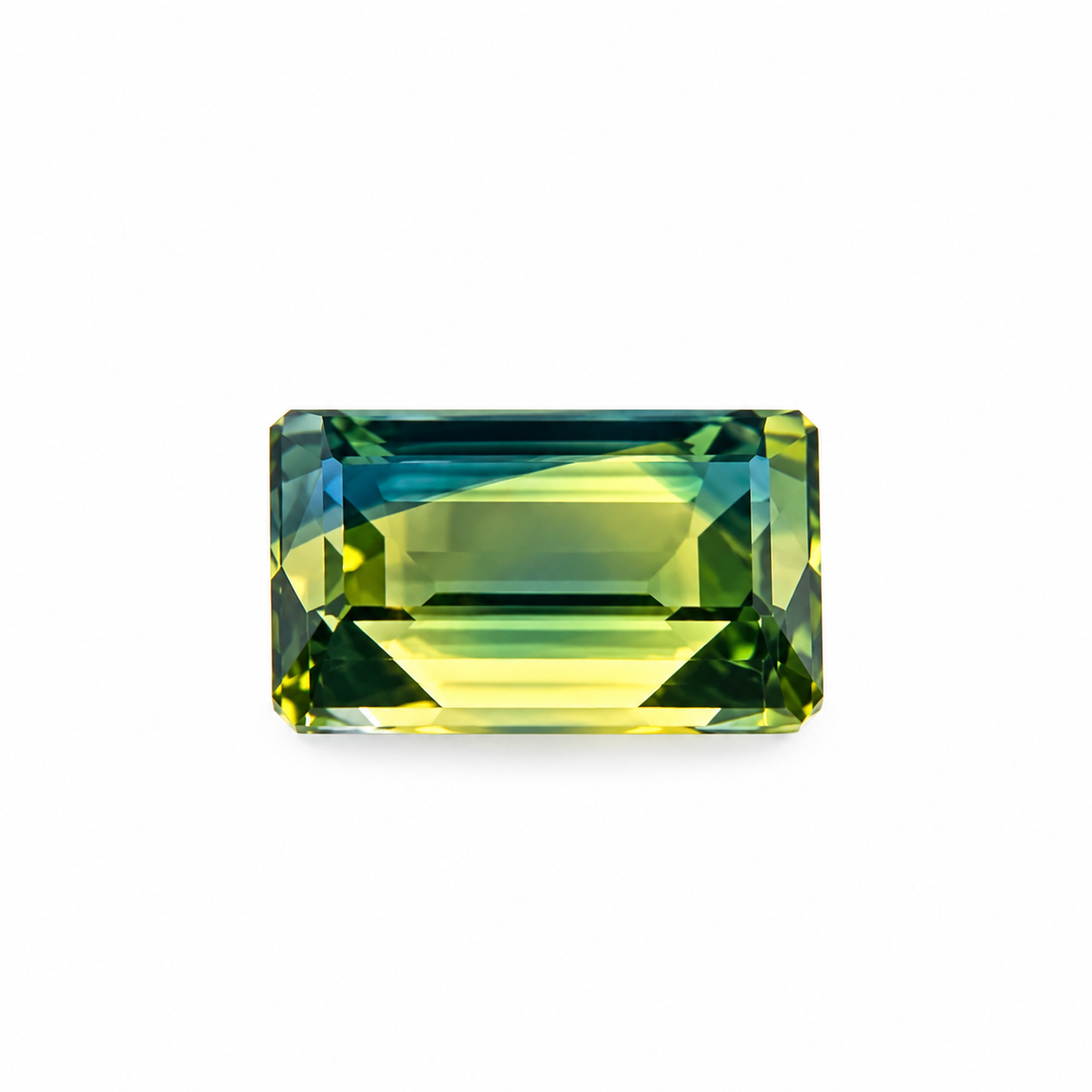 3.76ct Australian green and yellow emerald-cut sapphire displaying beautiful olive green, golden yellow and blue-green tones, available at Jules Collins Jewellery.
