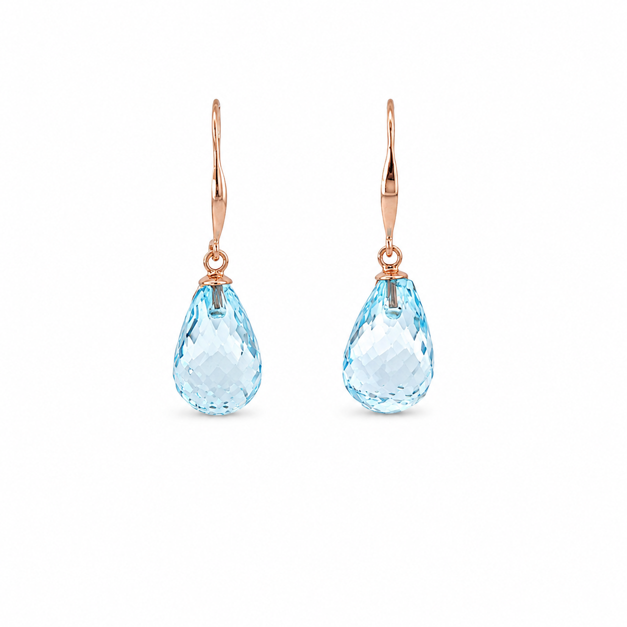 Pair of blue topaz drop earrings with 9 ct rose gold hooks on a white background