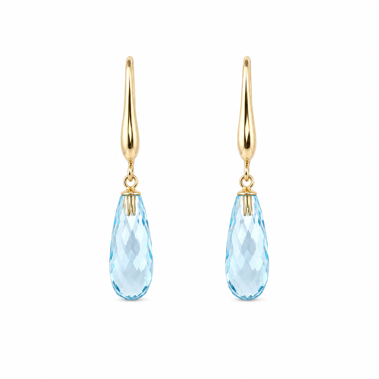 Pair of blue topaz drop earrings with faceted elongated stones and 9K yellow gold hooks on a white background