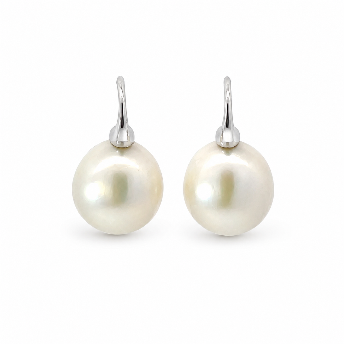Pair of baroque freshwater pearl drop earrings with sterling silver hooks on a white background