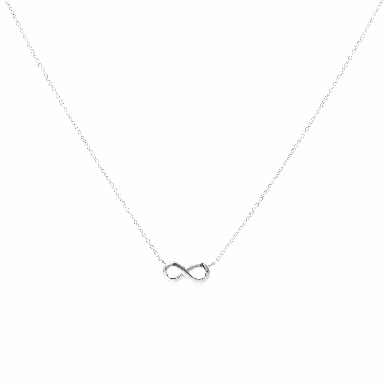 Delicate 925 sterling silver necklace with integrated infinity symbol and adjustable extension chain on a white background