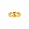 Polished yellow gold band ring featuring a delicate five-petal flower motif on the front.